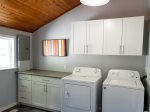 Laundry room with washer and dryer for guest use